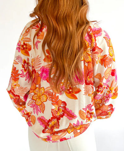 Orangefarbene Bluse mit Puffärmeln und Blumenmuster