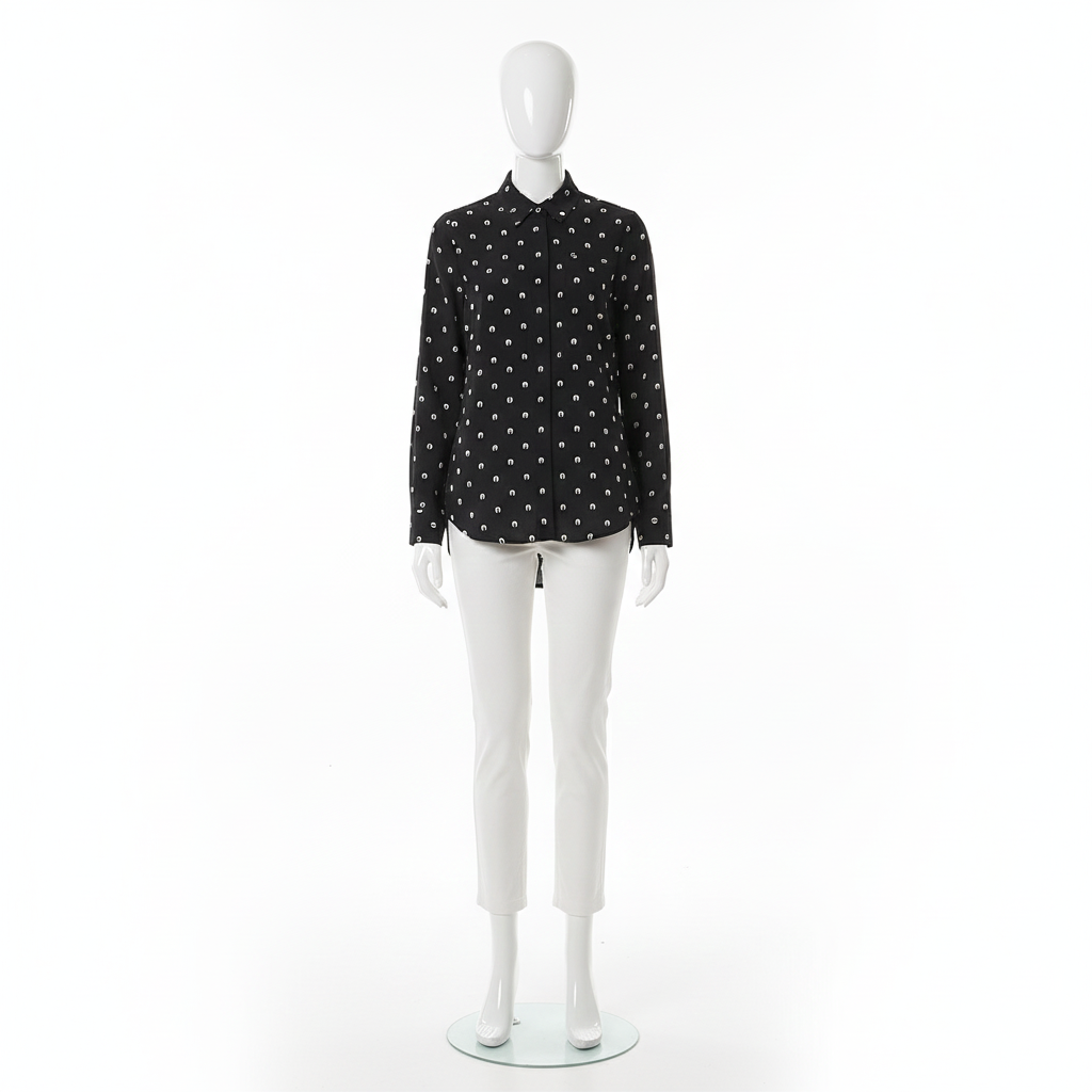 Mannequin wearing a black shirt with white polka dots on a white background