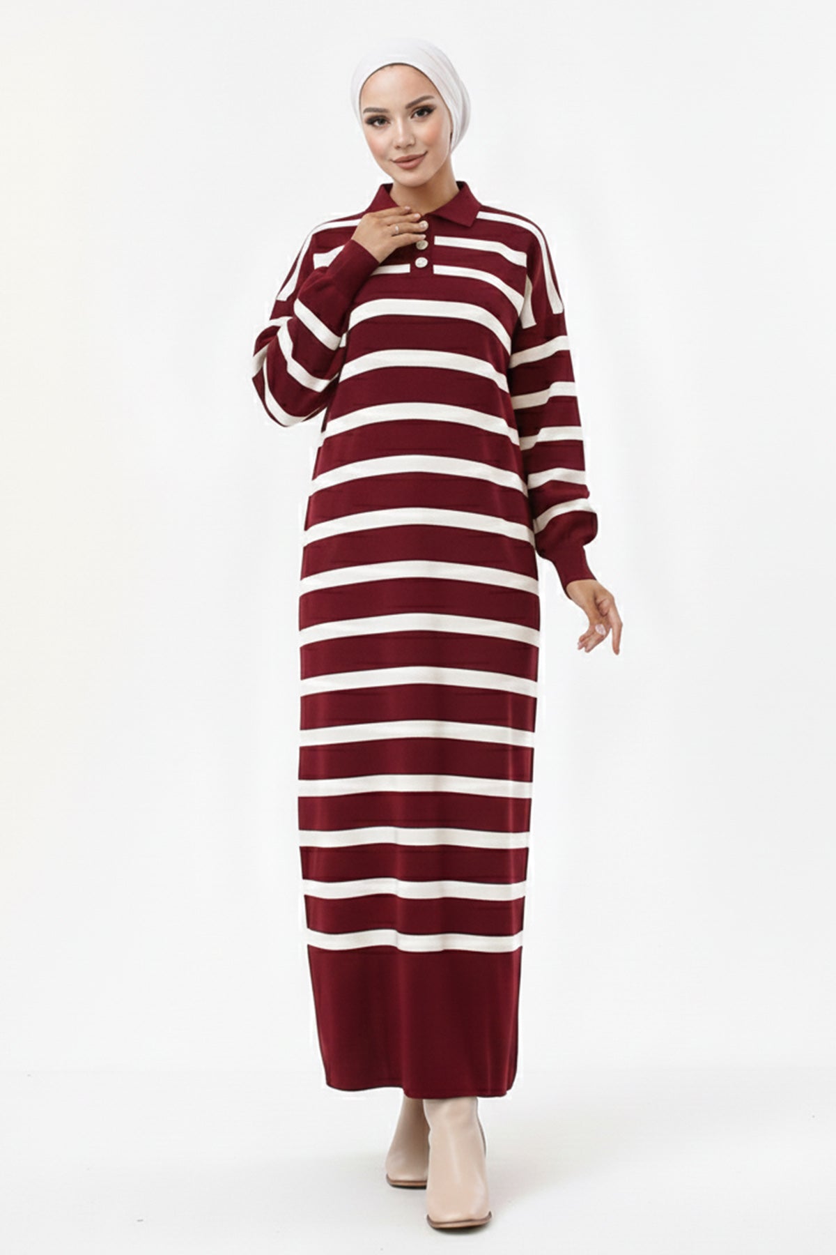 Woman wearing a maroon and white striped dress on a white background
