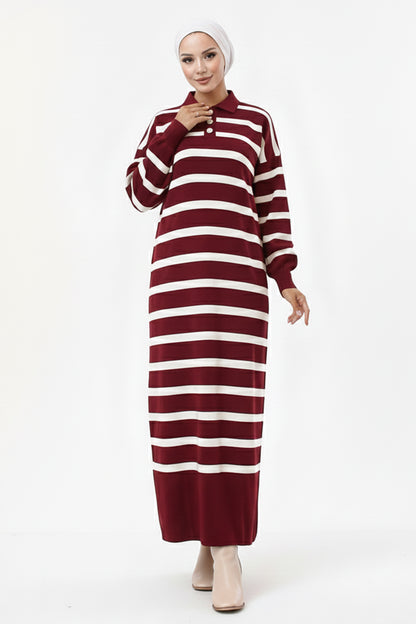Woman wearing a maroon and white striped dress on a white background