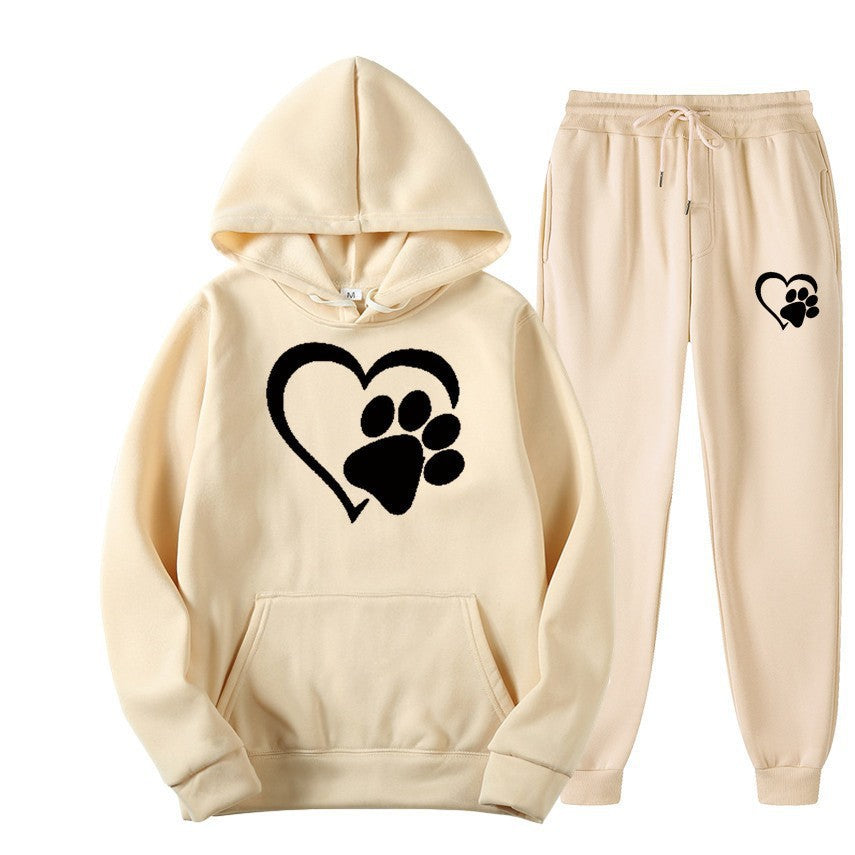 Beige hoodie and pants set with black paw heart design on a white background